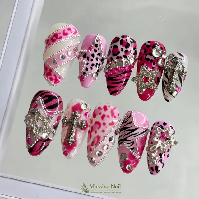 Hot pink leopard nails with crystal crosses