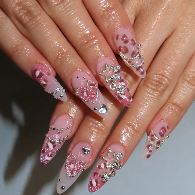 Pink leopard almond nails with charms
